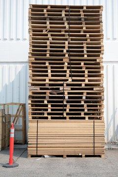Pile of used wooden pallets to recycle