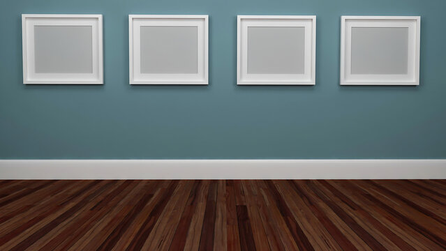 Four empty square picture frames mounted on a teal blue wall above hardwood