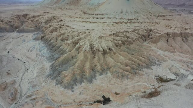 Aerial view of the eroded rock formations and arid landscape of Mount Zin in the Negev desert near Yeruham, South District, Israel.