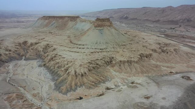 Aerial view of the rugged landscape of Mount Zin in the Negev desert, featuring dramatic rock formations and arid terrain in Yeruham, South District, Israel.