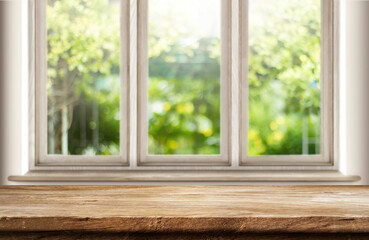 Fototapeta premium Empty table wood over window background, for your photo montage or product display, Space for placing items on the table, product and food display.