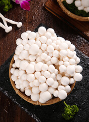 Fresh White Jade Mushrooms from Yunnan in Bamboo Bowl - Premium Wild Edible Fungi © NguyenVan