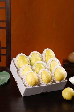 Premium Yellow Guava Fruits in White Gift Box with Protective Foam Packaging for Gourmet Fruit Delivery