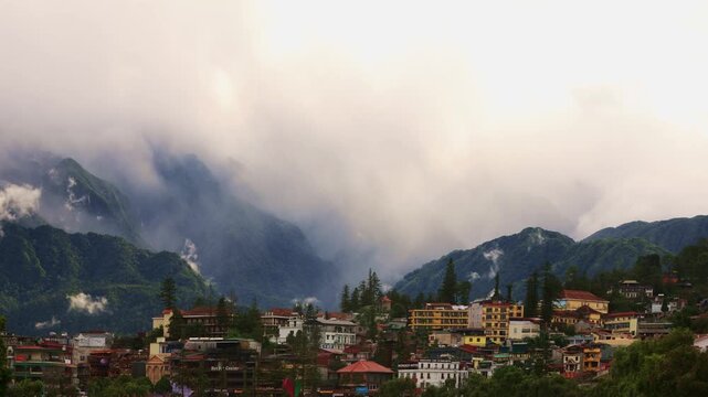 Sapa, popular tourist town nestled in the Ho&agrave;ng Li&ecirc;n Sơn mountains with dramatic mystic cauldron of thermal cloud movement,. Copy space.
