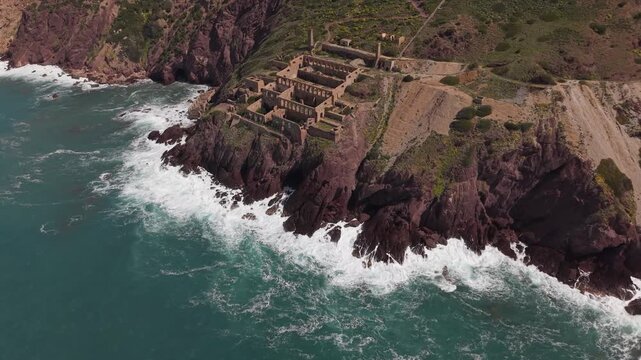 Laveria Lamarmora, Historic Mining Complex Perched On The Steep Cliffs Of Nebida On The Southwest Coast Of Sardinia, Italy. Aerial Drone Shot