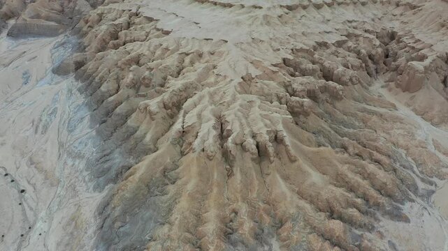 Aerial view of the rugged geological formations and arid landscape of Mount Zin in the Negev desert near Yeruham, South District, Israel.