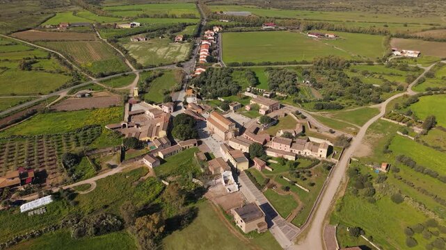Ghost Town With Cattedrale di Santa Maria di Monserrato Near Tratalias Vecchia In Sulcis Iglesiente, Italy. - aerial shot