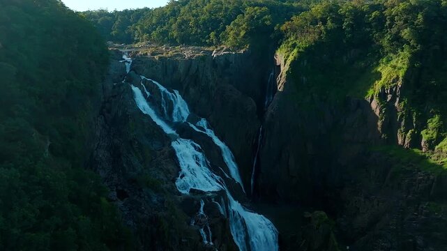 Aerial view of Barron Falls cascading down the lush tropical cliffs in Kuranda, Queensland, Australia.