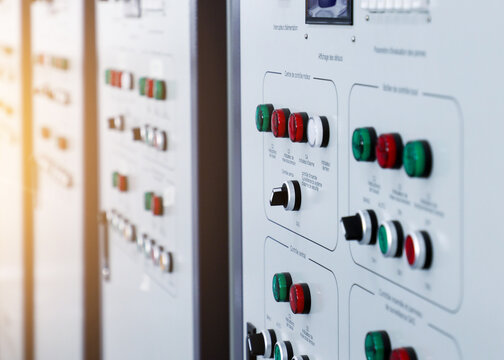 Industrial control panels with buttons and switches in a modern factory