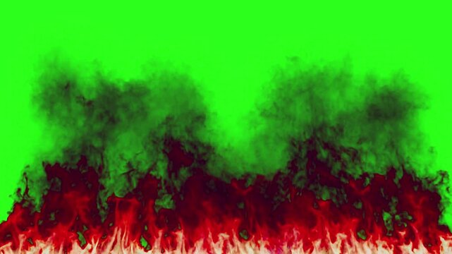 Fire and black smoke rise along the bottom border of a green screen background for chroma key compositing.