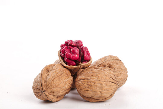 Fresh Xinjiang Walnuts with Red-Coated Kernel on White Background