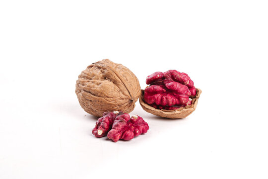 Red Xinjiang Walnuts with Crimson Meat on White Background - Premium Chinese Nuts
