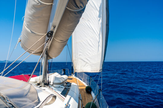 Sailing yacht cruising across the Adriatic Sea under full sail. Freedom and adventure during a long distance sailing voyage.