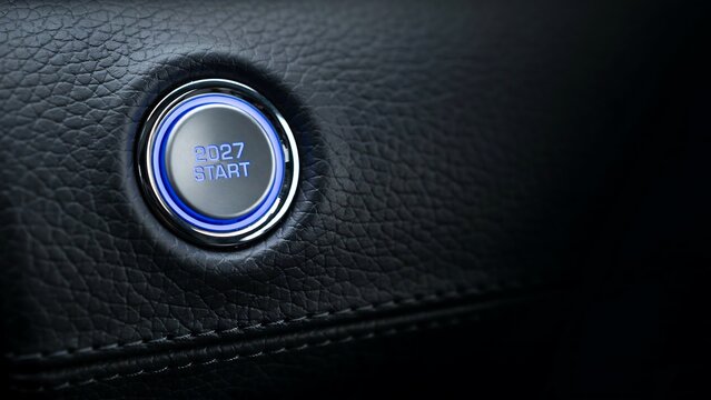 2027 start button inside modern car dashboard representing a new journey