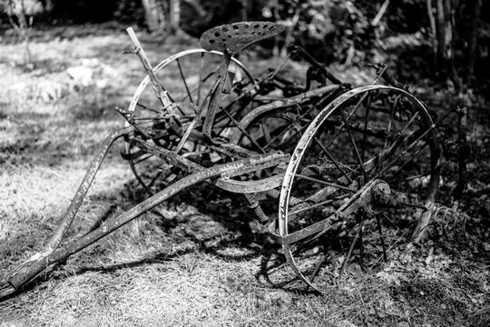 Old Rusted Agricultural Machine in Rural Setting