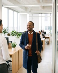 Obraz premium Generative AI, Smiling Black businessman arriving at a bright open office with coffee