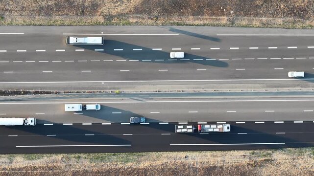 Aerial view of highway traffic with vehicles driving on a multi-lane road in Sausheim, Grand Est, France.