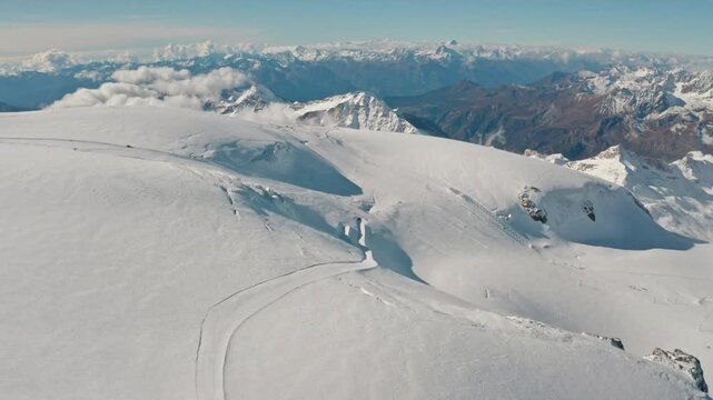 Flyover above the summer ski area at Matterhorn Glacier Paradise near Klein Matterhorn, showcasing glacier pistes, alpine terrain and sweeping panoramic views in Zermatt, Switzerland.