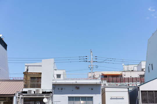 Cityscape of Fukuoka, Japan with mixed buildings and expansive blue sky copy space