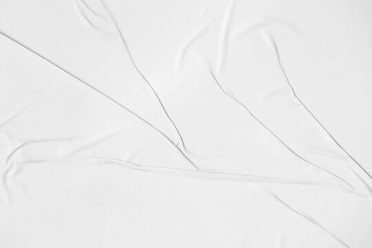 Crumpled paper texture overlay effect PNG, white paper wrinkled poster template, blank glued creased paper sheet mockup. white poster mockup on wall.