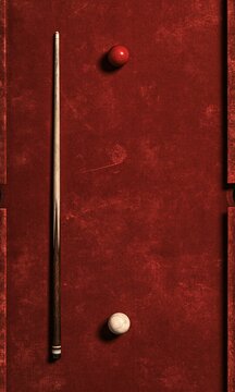 Traditional red felt pool billiards table with one wooden cue stick one white cue ball and one red object ball arranged in straight vertical line vintage minimalist still life