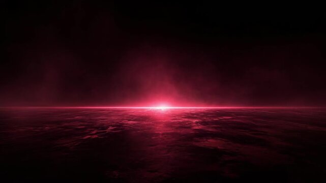Glowing red light with fog over a dark reflective surface