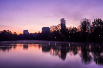 Fototapeta premium sunrise over the river in the city