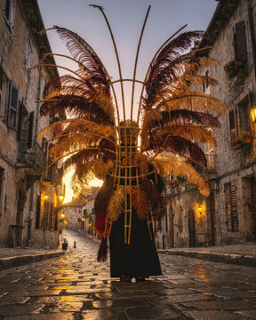Traditional Feathered Costume Figure in Old Stone Town Street