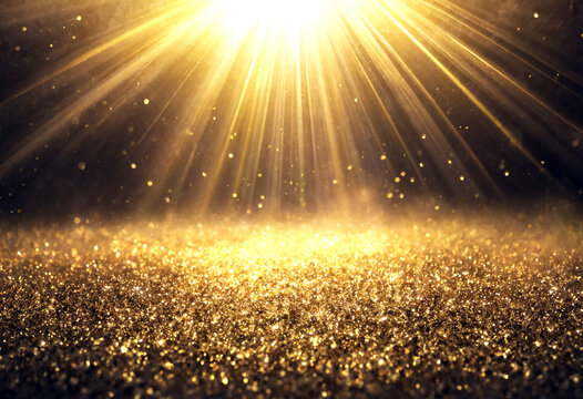 Dazzling golden light rays shining brightly over a sparkling glittery surface with radiant glow effect
