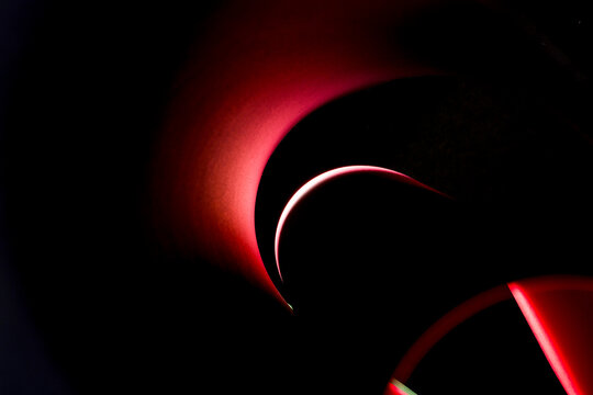 Abstract background of colored paper sheets on a black background