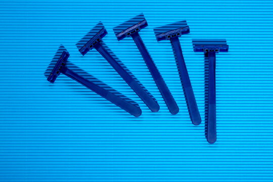 Shaving razors on a colored background