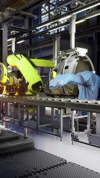 Robots with bright green arms work diligently on an assembly line, assembling products with precision. Bright lights illuminate the busy manufacturing environment filled with machinery.