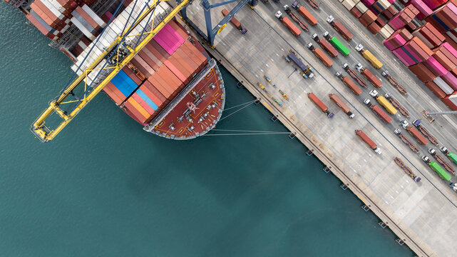 Aerial view Container cargo ship loading unloading container import export sea port, Global trade business container cargo ship freight shipping commercial trade logistic transportation international.