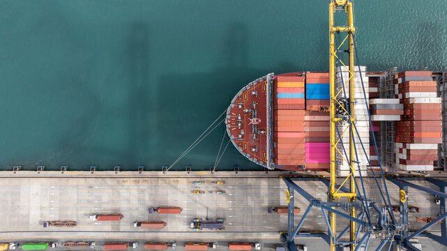 Aerial view Container cargo ship loading unloading container import export sea port, Global trade business container cargo ship freight shipping commercial trade logistic transportation international.