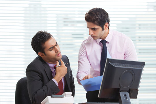 Executives talking over new business project 
