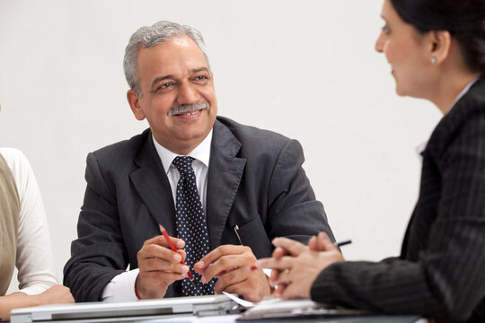 Happy business executives in meeting 