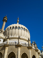 Ornate domes of Brighton Pavilion against blue sky, England, UK. © Cavan