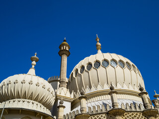 Ornate domes of Brighton Pavilion against blue sky, England, UK. © Cavan