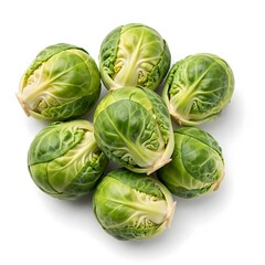 Fototapeta premium Fresh green Brussels sprouts, neatly clustered on a white background. Overhead view highlights their crisp texture and wholesome appeal for healthy culinary use