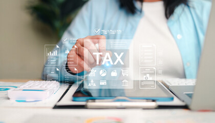 Fototapeta premium Tax planning and financial management concept showing a business person reviewing tax documents, digital financial data, accounting reports, and savings information
