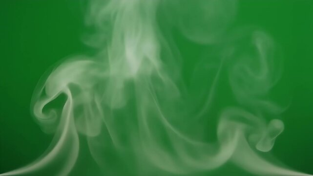 Wisps of white smoke gently swirling against a solid green background.