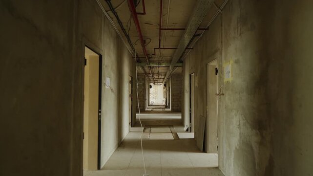 Construction progress of a modern concrete building. Reinforced concrete structure under development, showing structural framework and ongoing construction work.