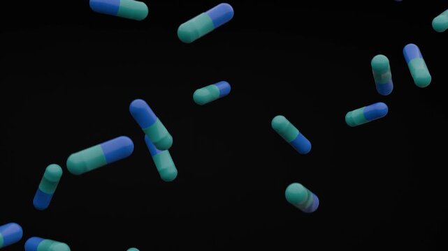 blue and green white pills fall on the black background, 3d animation