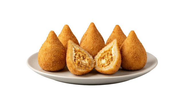 Plate of golden fried coxinha snacks filled with shredded chicken and creamy cheese is presented on a white dish against a grey background.