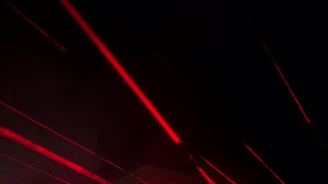 Multicolor Laser Beams Sweeping Across the Night Sky, Vibrant Atmospheric Light Show