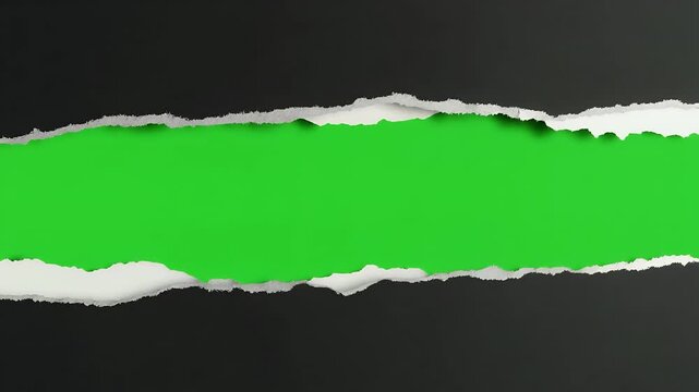 A horizontal tear in black paper reveals a vibrant green background.