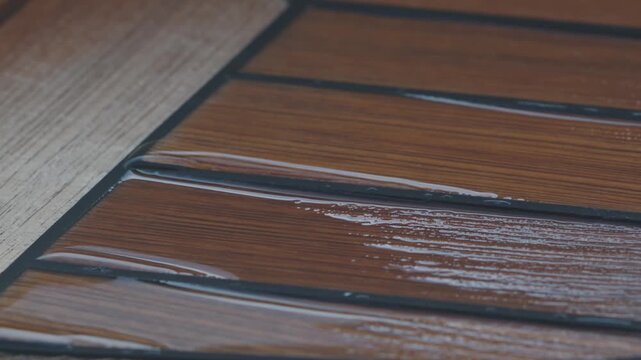 Some water on the teak deck after raining