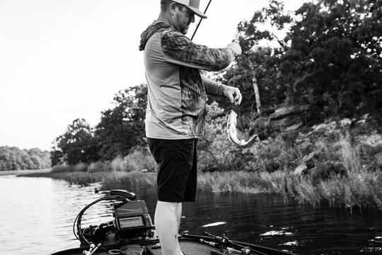 Fisherman showing off his largemouth bass catch