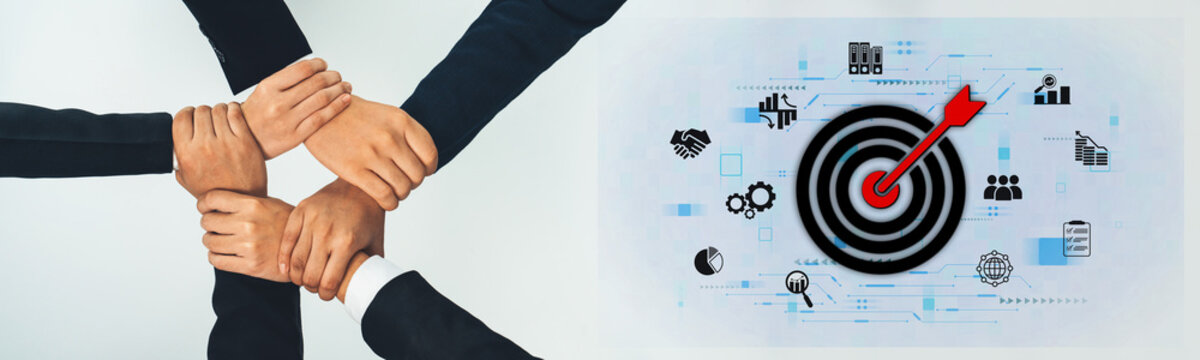 Image depicting diverse hands joining together, emphasizing teamwork and collaboration in a business setting alongside an arrow hitting a target, representing shared goals. Trope