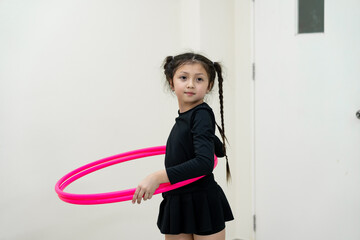 Kid girl playing Hula hoop © chachamp